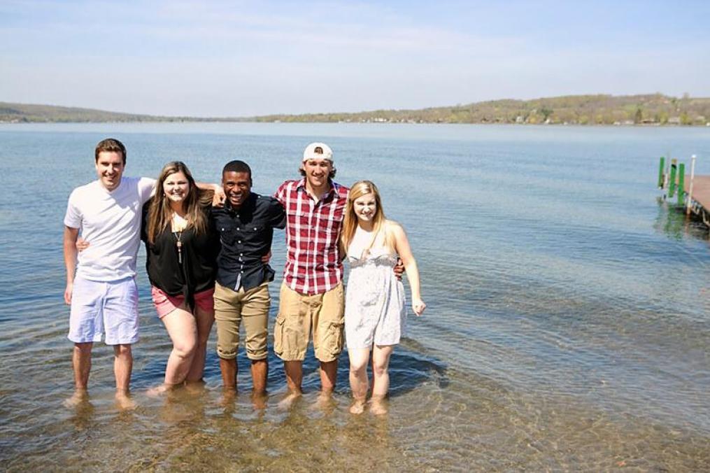 Students standing on the shore of Point Neamo