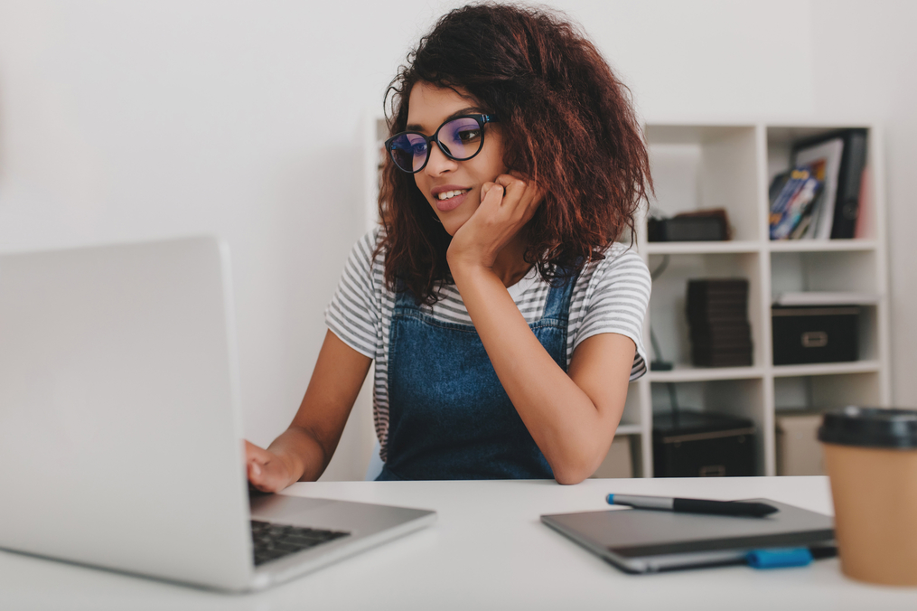 young woman in front of a computer