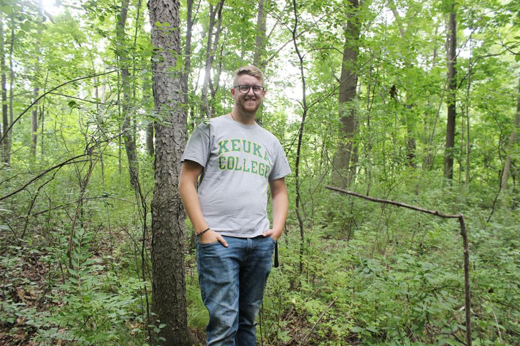 Senior Dan Lazzaro in his "natural" element. The environmental science major stands where a cross-country trail will be cleared for the Penn Yan Academy cross-country team.