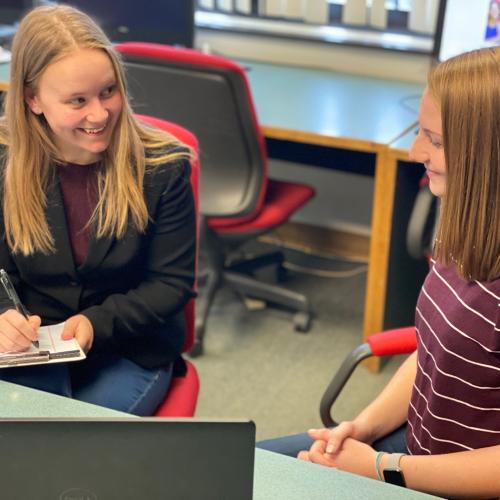 A Community Health and Wellness degree allows you to work in non-clinical settings to help people improve their health. Here, a Community Health worker visits with a patient.