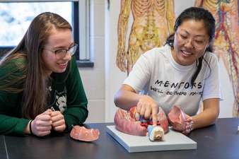 Shaelyn Diamond and Theresa Shintz Studying in Biology Lab